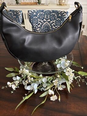 Minimalist Black Crescent Shoulder Bag with Gold Hardware